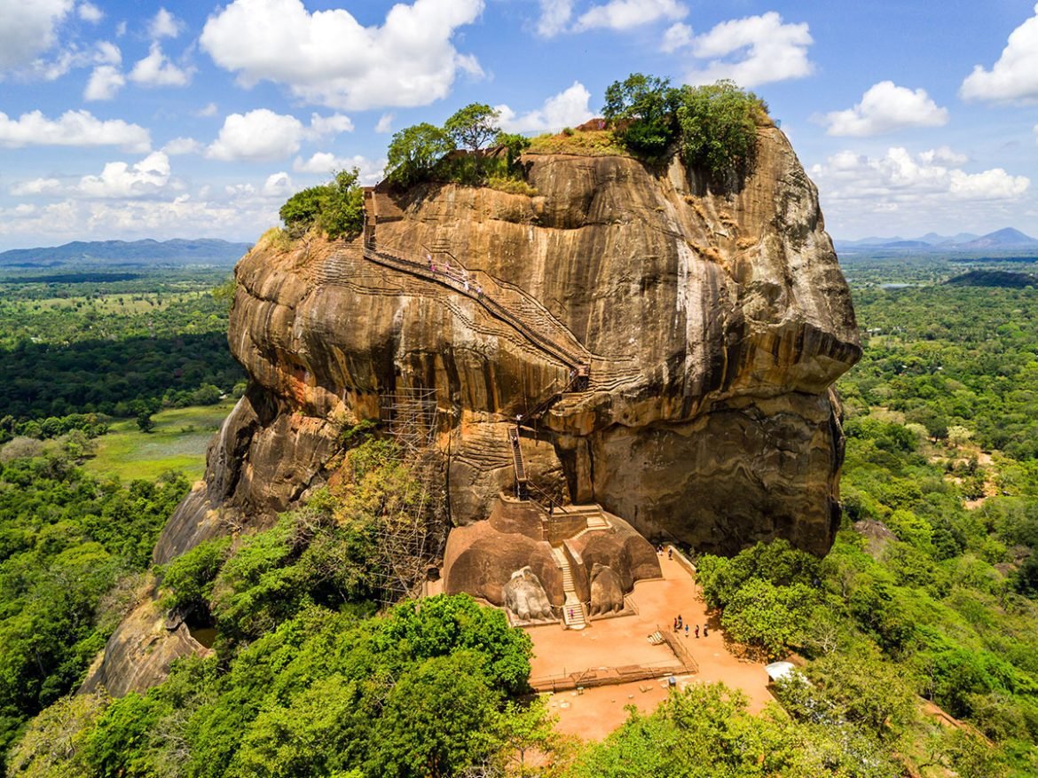 Aerial view from above of Sigiriya or the Lion Rock, an ancient fortress and a palace with gardens, pools, and terraces atop of granite rock in Dambulla, Sri Lanka.