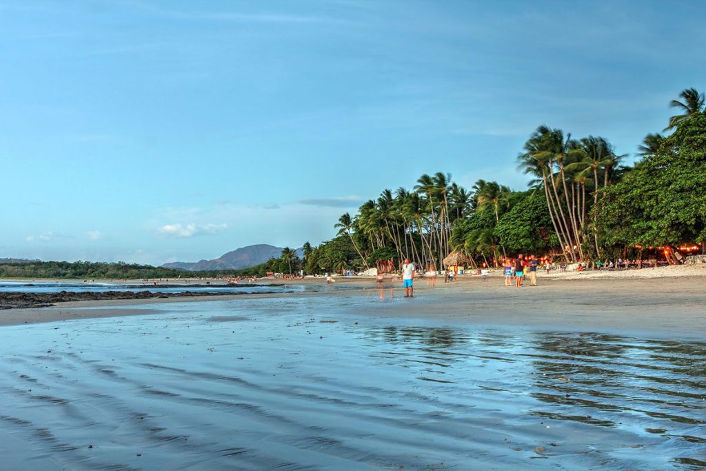 Tamarindo Beach with turquoise water and palm trees in Guanacaste, Costa Rica