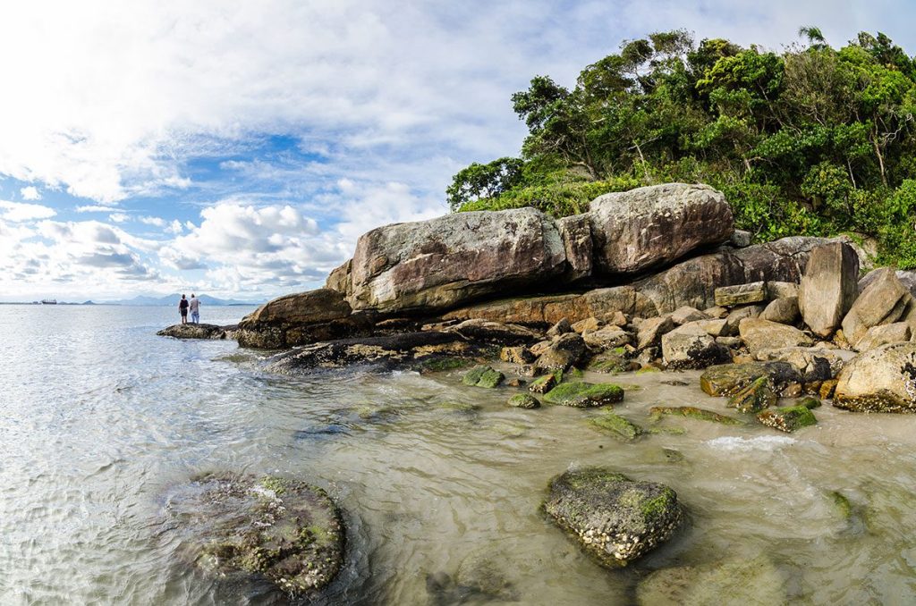 Wild beach with rocks and trees at Ilha do Mel