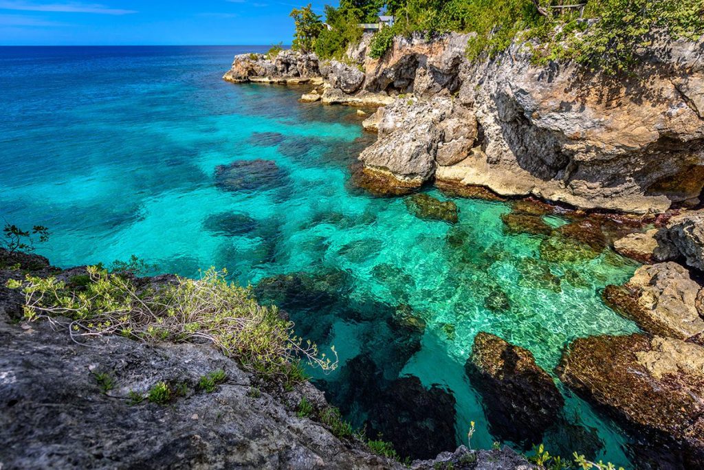 Turquoise water near cliffs in Negril, Jamaica