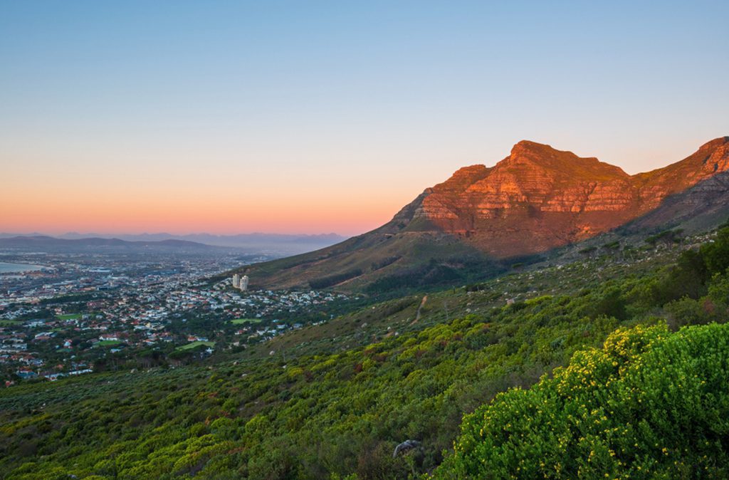 Landscape view of the Table Mountain national park and the cityscape of Cape Town at sunset, Western Cape Province, South Africa
