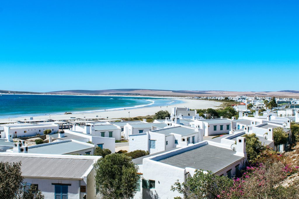 View of Paternoster town with white houses and ocean shoreline.