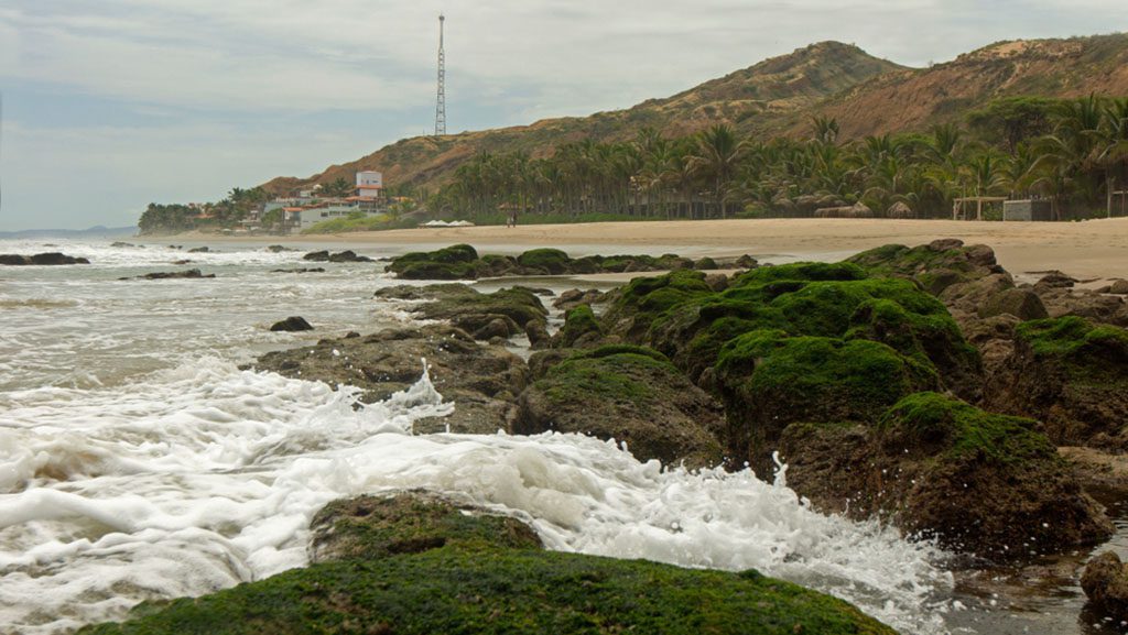 View of the Las Pocitas sector on the beach of Mancora on a cloudy day by Alejo Miranda