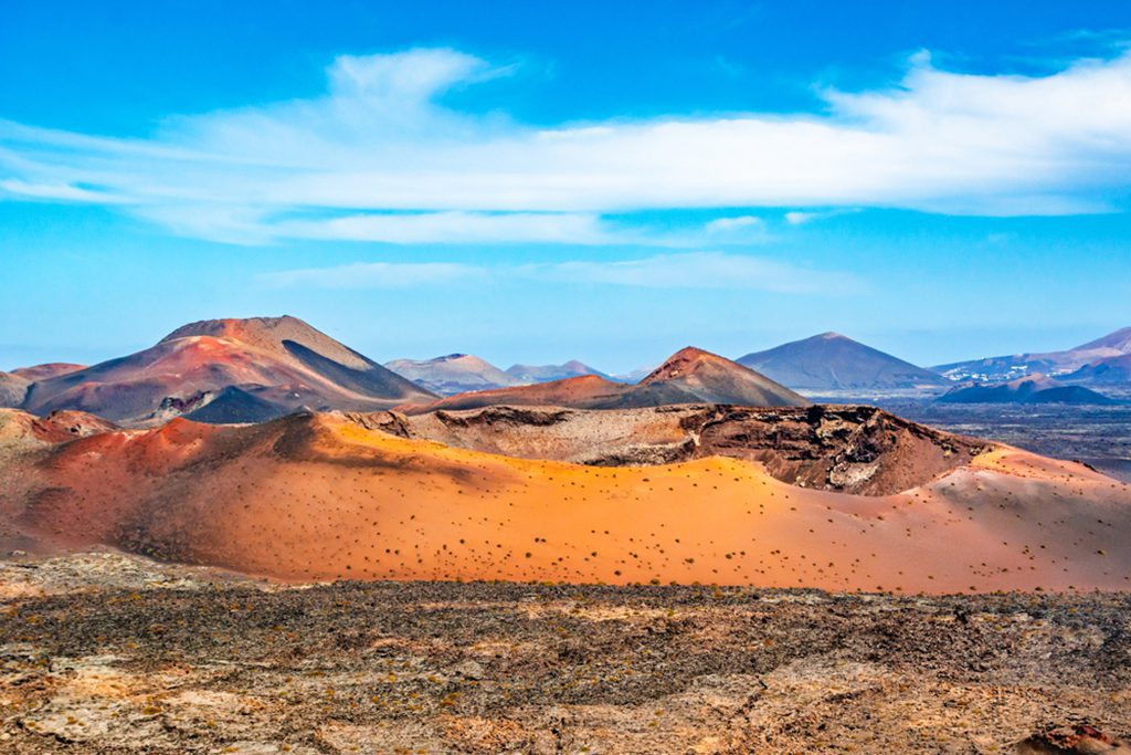 Panoramic landscape of volcano craters in Timanfaya National Park