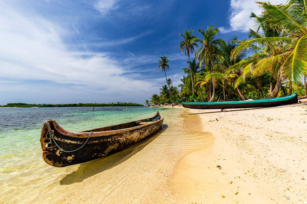 Dugout canoes on beautiful sand beach on San Blas Islands, Panama.