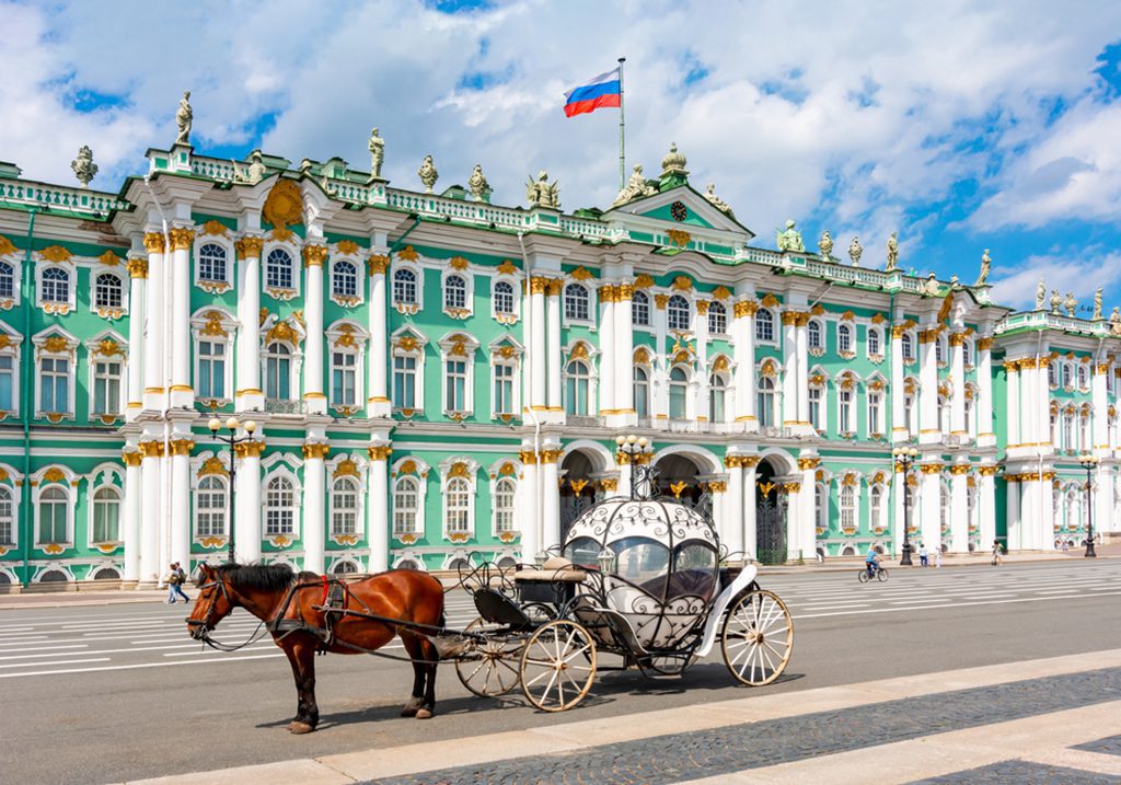 Horse carriage at Palace Square with Hermitage Museum in background