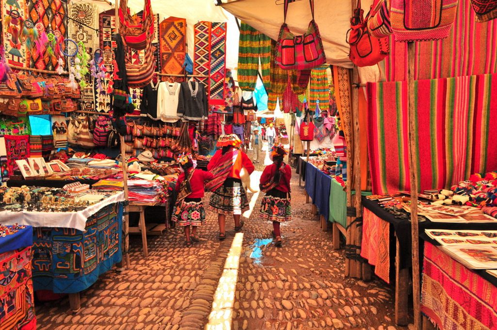 Peruvian family walking through a local market