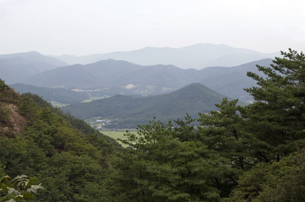 Scenic landscape in the Gyeongju National Park, South Korea, with mountains and trees.