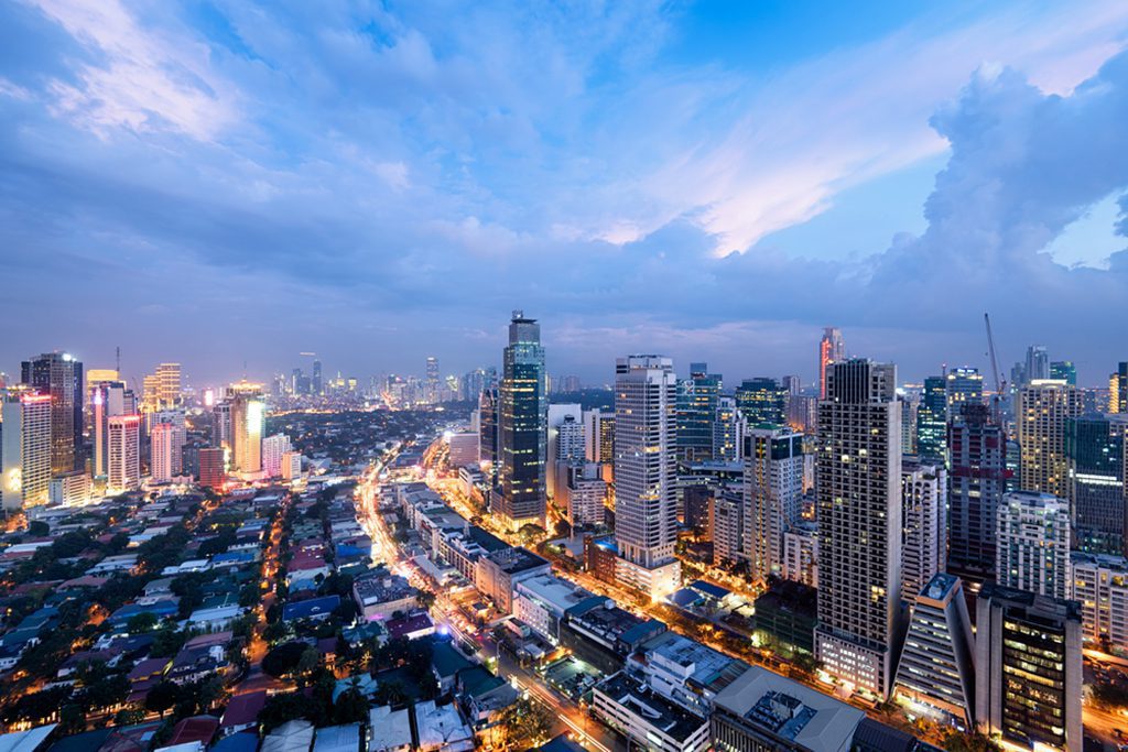 Makati City skyline at night in Manila, Philippines