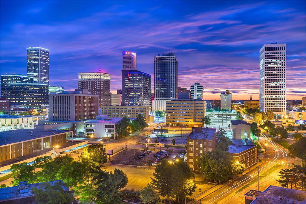 Tulsa, Oklahoma skyline with colorful sunset sky.
