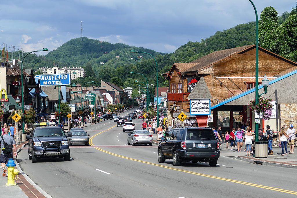 Downtown Gatlinburg with the Smoky Mountains in the background.