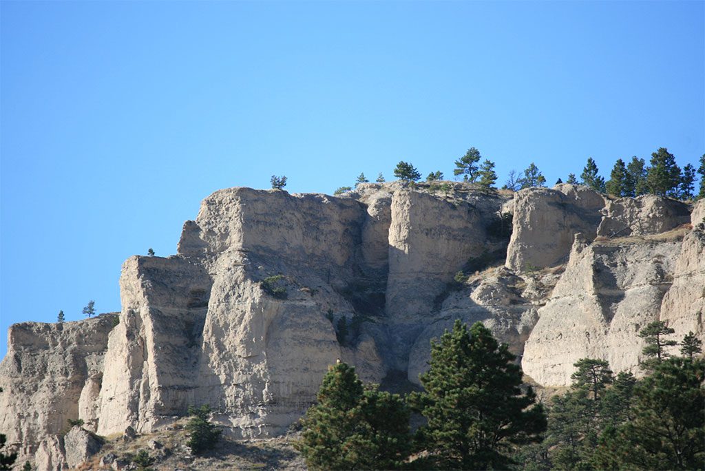 Fort Robinson State Park landscape with blue sky and green trees