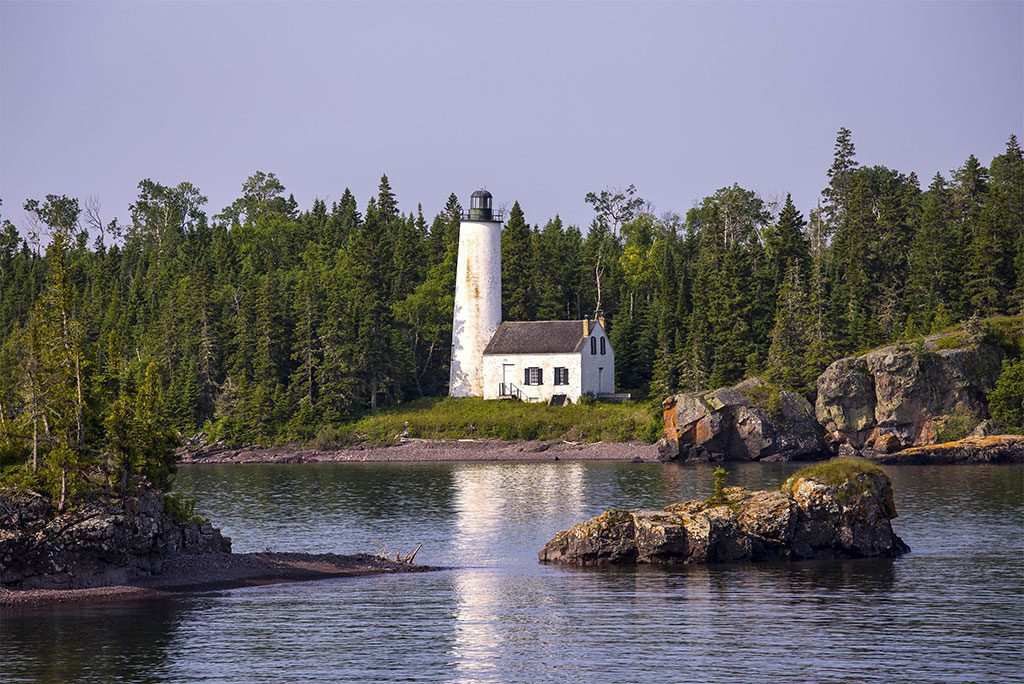 Lighthouse on a rocky shore in Isle Royale National Park, Michigan.