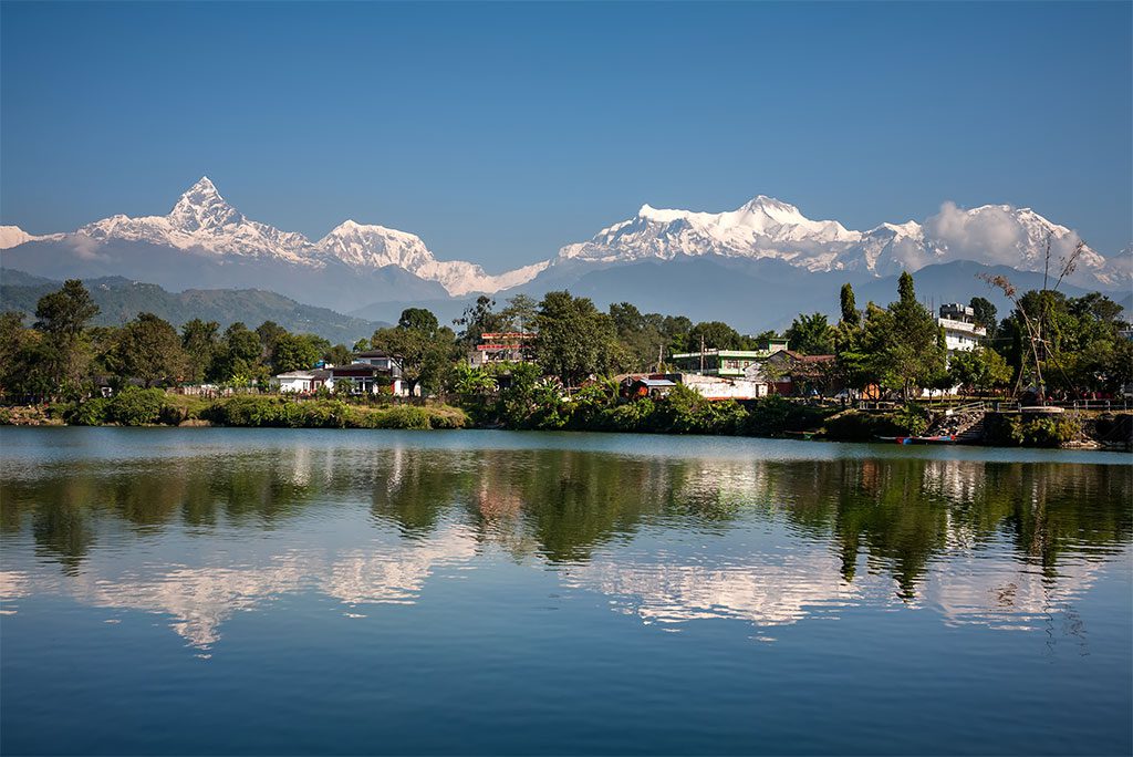 Annapurna Mountain range and its reflection in Phewa lake in Pokhara, Nepal