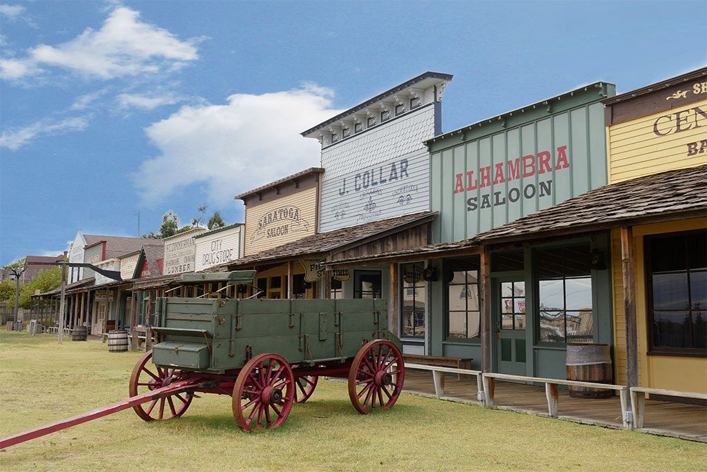 : Façade of the Front Street replica with a chuck wagon at the Boot Hill historical museum in Dodge City, Kansas