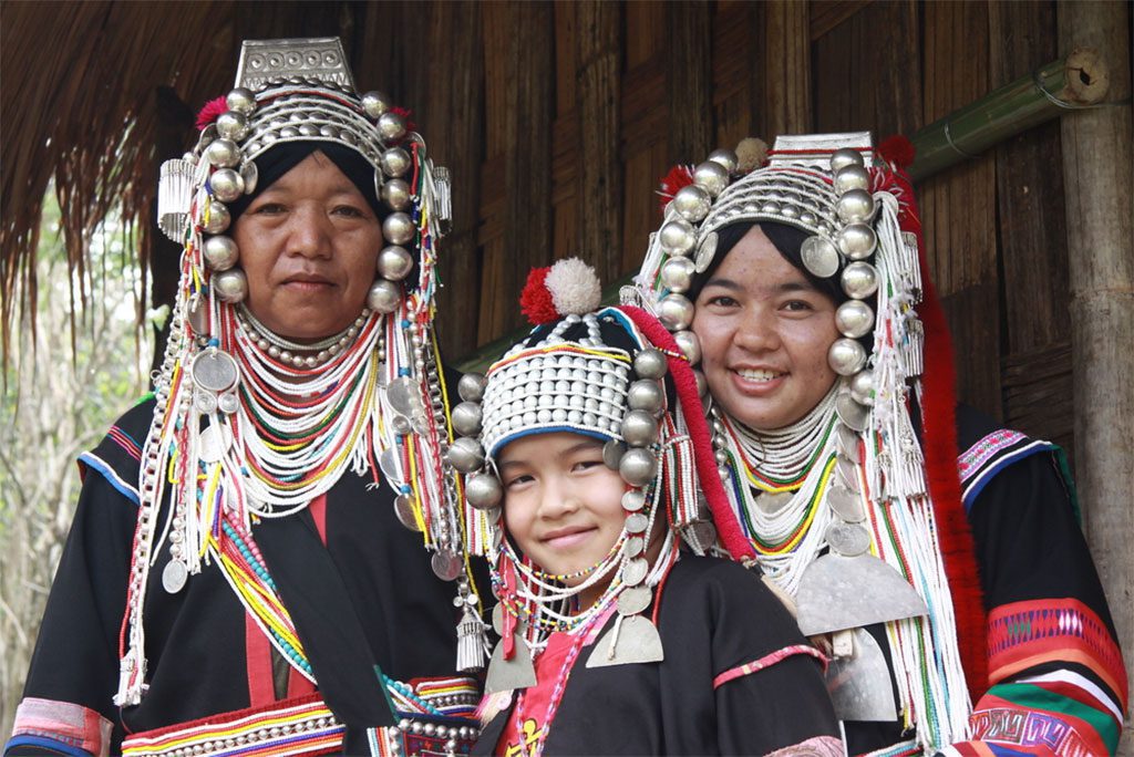 A family wearing traditional Akha clothing