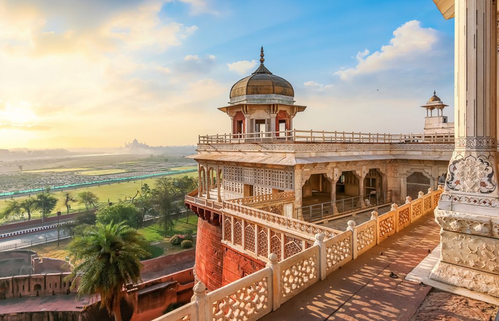 Agra Fort, a medieval Indian fort made of red sandstone and marble, with a view of the dome.