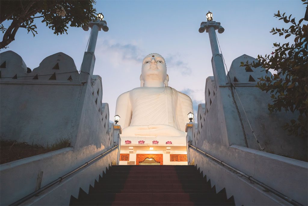 White Buddha statue at Sri Maha Bodhi Viharaya in Kandy, Sri Lanka