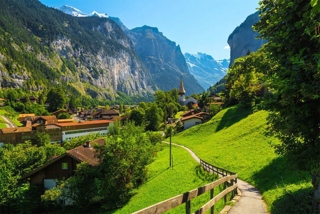 Tourist alpine village in deep valley