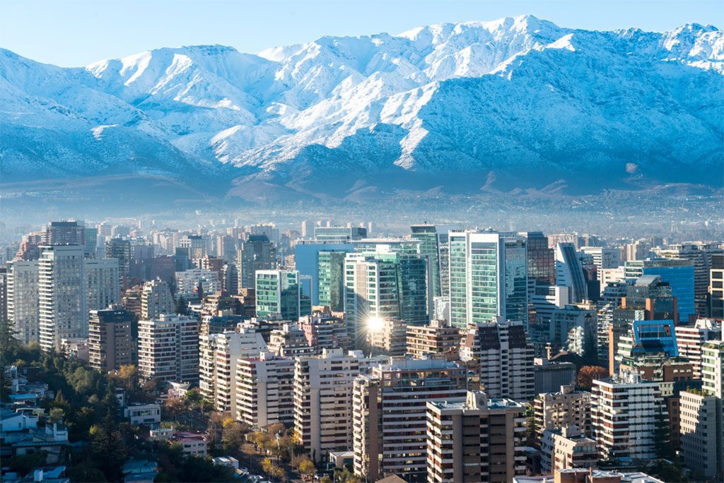 Santiago white cityscape viewed from above with blue sky and clouds
