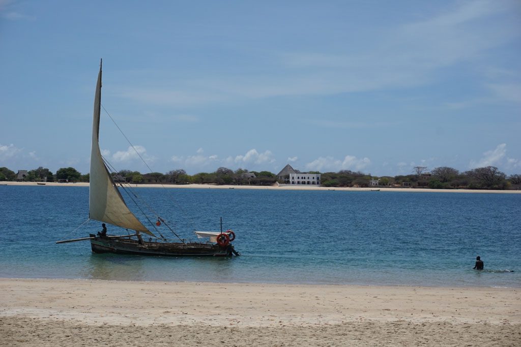 Traditional Dhow passing by between Lamu Island and Manda Island, Kenya