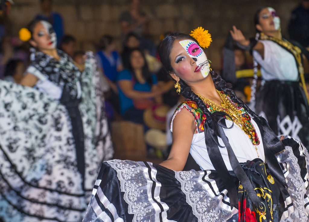 Participants at a Day of the Dead carnival in Oaxaca, Mexico