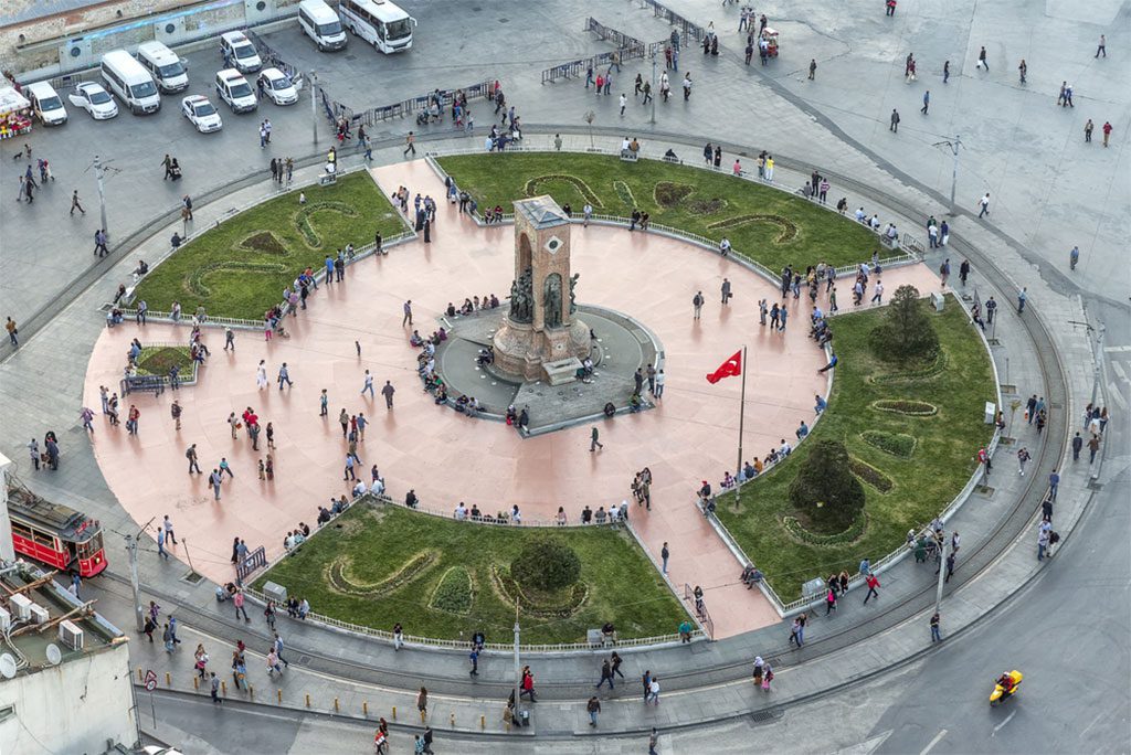 Cars and people in the busy Taksim Square in Istanbul, Turkey