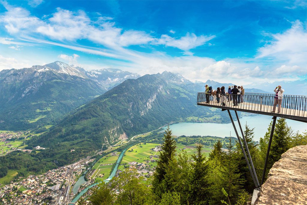  People standing on the observation deck in Interlaken, Switzerland on a beautiful summer day