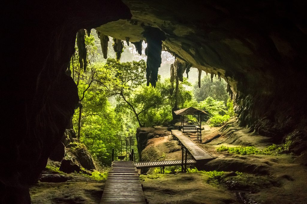 Cave entrance with plank walk and pavilion, Niah National Park
