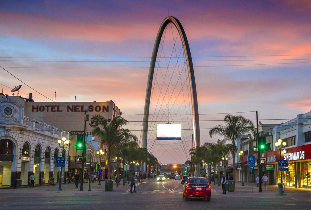 Avenida Revolucion, Tijuana's main tourist street, with the millennial arch at dusk"