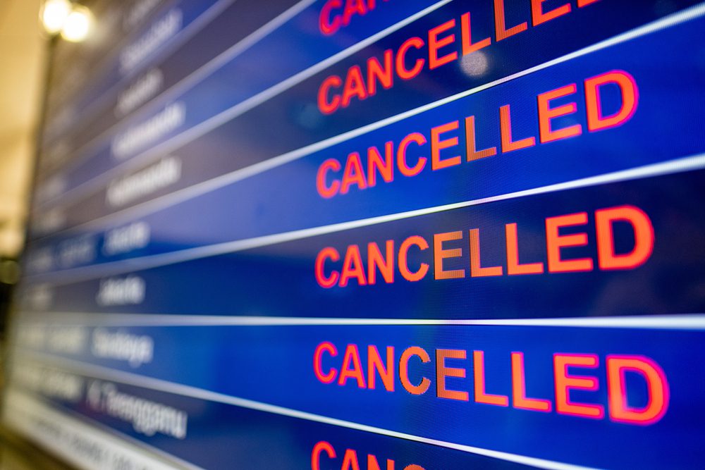 An airport screen displaying canceled flights due to the Coronavirus pandemic