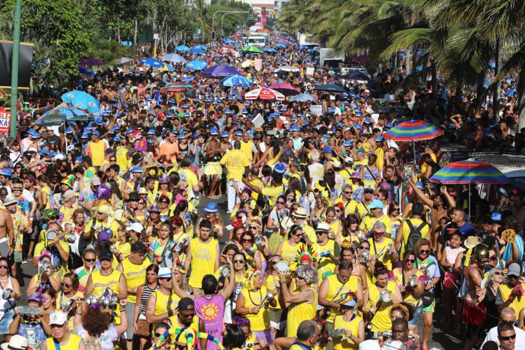 A bustling crowd of revelers enjoying the street carnival festivities in Ipanema, Rio de Janeiro.