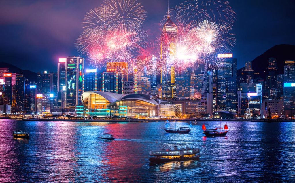 A breathtaking firework display lighting up the night sky at Hong Kong Victoria Harbor.
