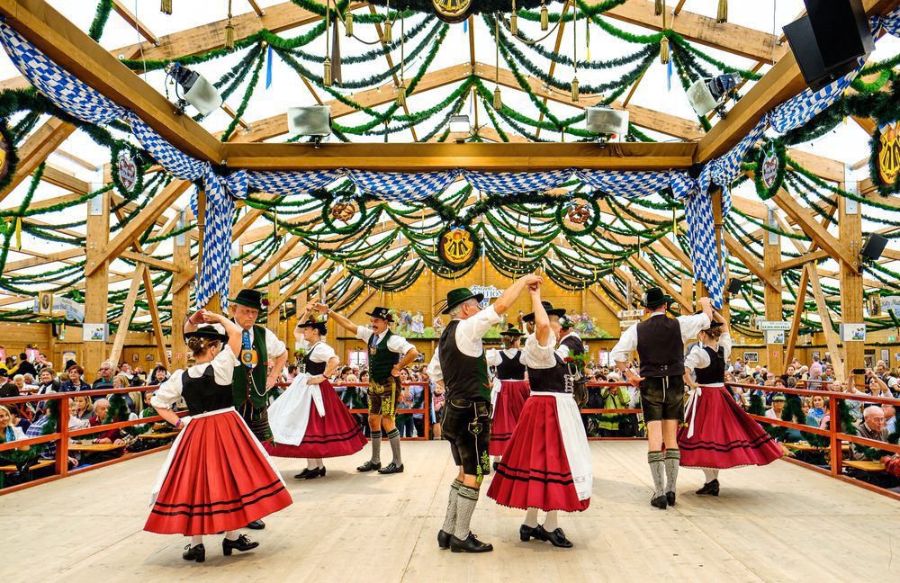Vibrant scene inside a traditional beer tent at Oktoberfest in Munich, Germany.