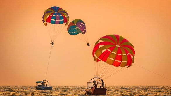 Parasailing at sunset - A thrill among the 20 things to do in Goa, Baga beach
