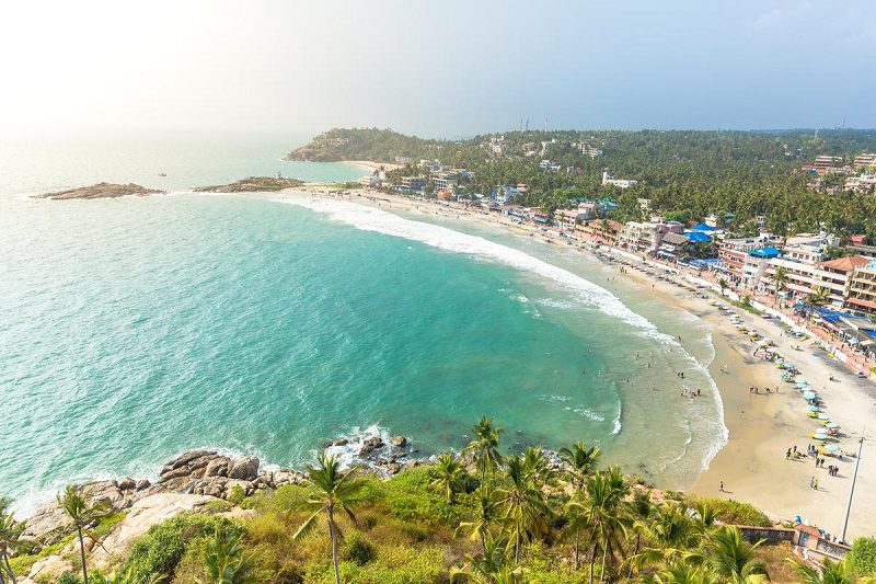 Aerial View of Tourists Enjoying the Waters: Trivandrum One Day Trip
