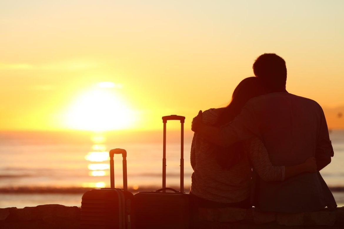 Rear View of Couple Silhouette, Tourists Enjoying a Romantic December Vacation: best countries to visit in december for couples